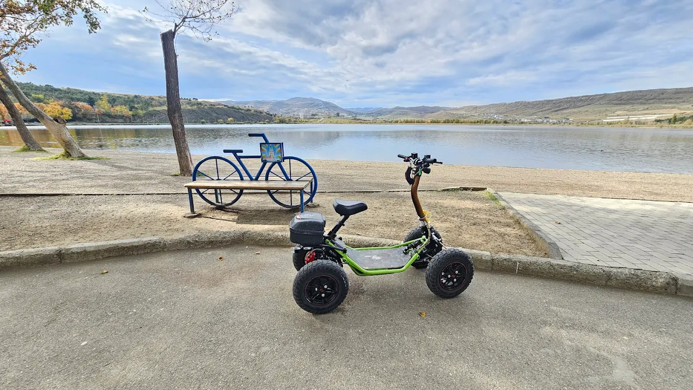 Green EZRider scooter by the lake